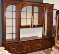A modern mahogany veneered and glazed display cabinet