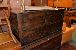 An oak mule chest, circa 1700, with geometric panels, 66cm high, 124cm wide, 50cm deep