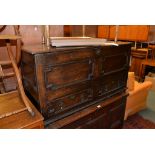 An oak mule chest, circa 1700, with geometric panels, 66cm high, 124cm wide, 50cm deep