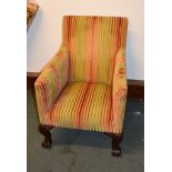 A mahogany and upholstered chair in George II style, on cabriole legs and claw and ball feet, and