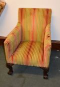 A mahogany and upholstered chair in George II style, on cabriole legs and claw and ball feet, and