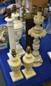 Five various carved alabaster table lamps, 20th century, the largest 56cm high overall; and a modern
