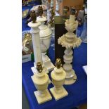 Five various carved alabaster table lamps, 20th century, the largest 56cm high overall; and a modern