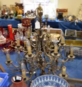 A Continental gilt metal six branch twelve light chandelier, suspending clear and amber glass drops,