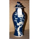 A Chinese blue and white 'prunus' vase and cover, 27cm high, and a Staffordshire pottery model of