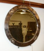 Ω A beaten silver on copper wall mirror in Arts & Crafts taste, with mother-of-pearl inlaid motifs,
