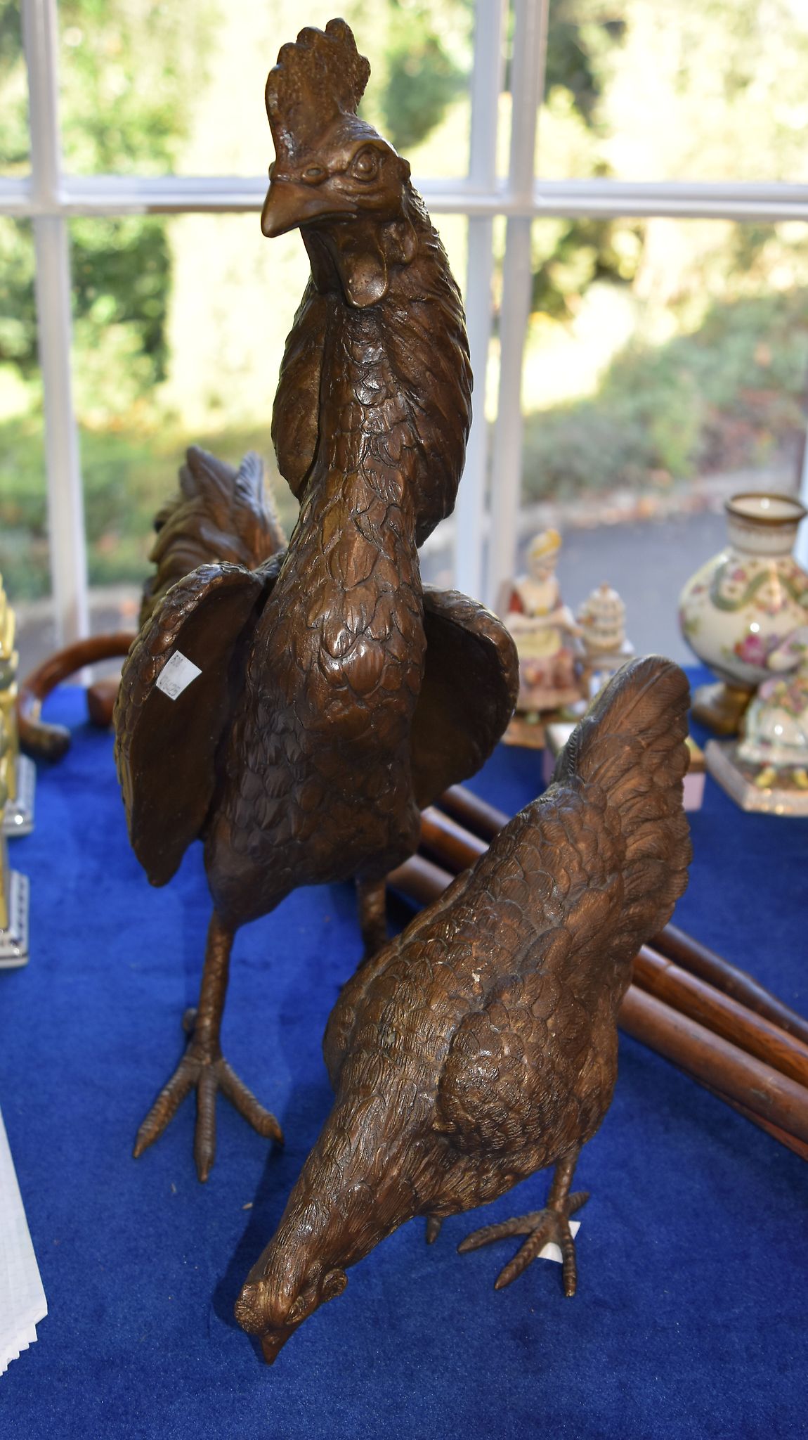 A modern pair of bronze figures of a cockerel and hen, 47cm and 22cm high