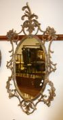 A George III style oval wall mirror in the Rococo taste, modern, 134cm high
