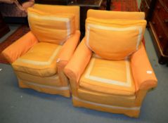 A pair of armchairs in orange upholstery and a late Victorian walnut and upholstered low armchair,