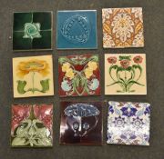 A box containing a quantity of various tiles, printed and Majolica type