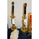 A pair of gilt and painted metal figural table lamps in Empire taste, 20th century, the shafts