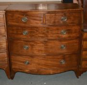 A George III mahogany chest of drawers, 107cm high, 104cm wide, and a dressing mirror, early 19th