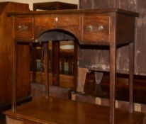 A George III side table/dressing table, with three frieze drawers above an arched kneehole, 85cm