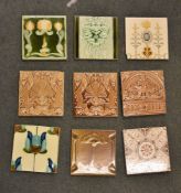 A box containing a quantity of various tiles, printed and Majolica type