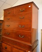 A mahogany chest of drawers, 19th century, two short and three long drawers each with gilt brass