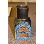 A Troika spice jar with blue ground modelled in relief, possibly by Avril Bennett, 15cm high