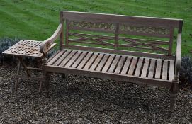 A carved teak garden bench, modern, 92cm high, 148cm wide; and a modern teak folding occasional