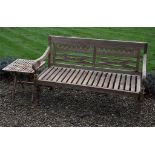 A carved teak garden bench, modern, 92cm high, 148cm wide; and a modern teak folding occasional