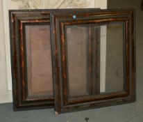 A pair of simulated tortoiseshell frames, vacant, each 73cm x 66cm