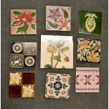 A box containing a quantity of various tiles, printed and Majolica type, including Minton & Maw