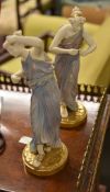Two Royal Worcester figurines of maidens, classically draped, modelled in the manner of James