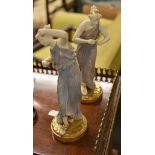 Two Royal Worcester figurines of maidens, classically draped, modelled in the manner of James