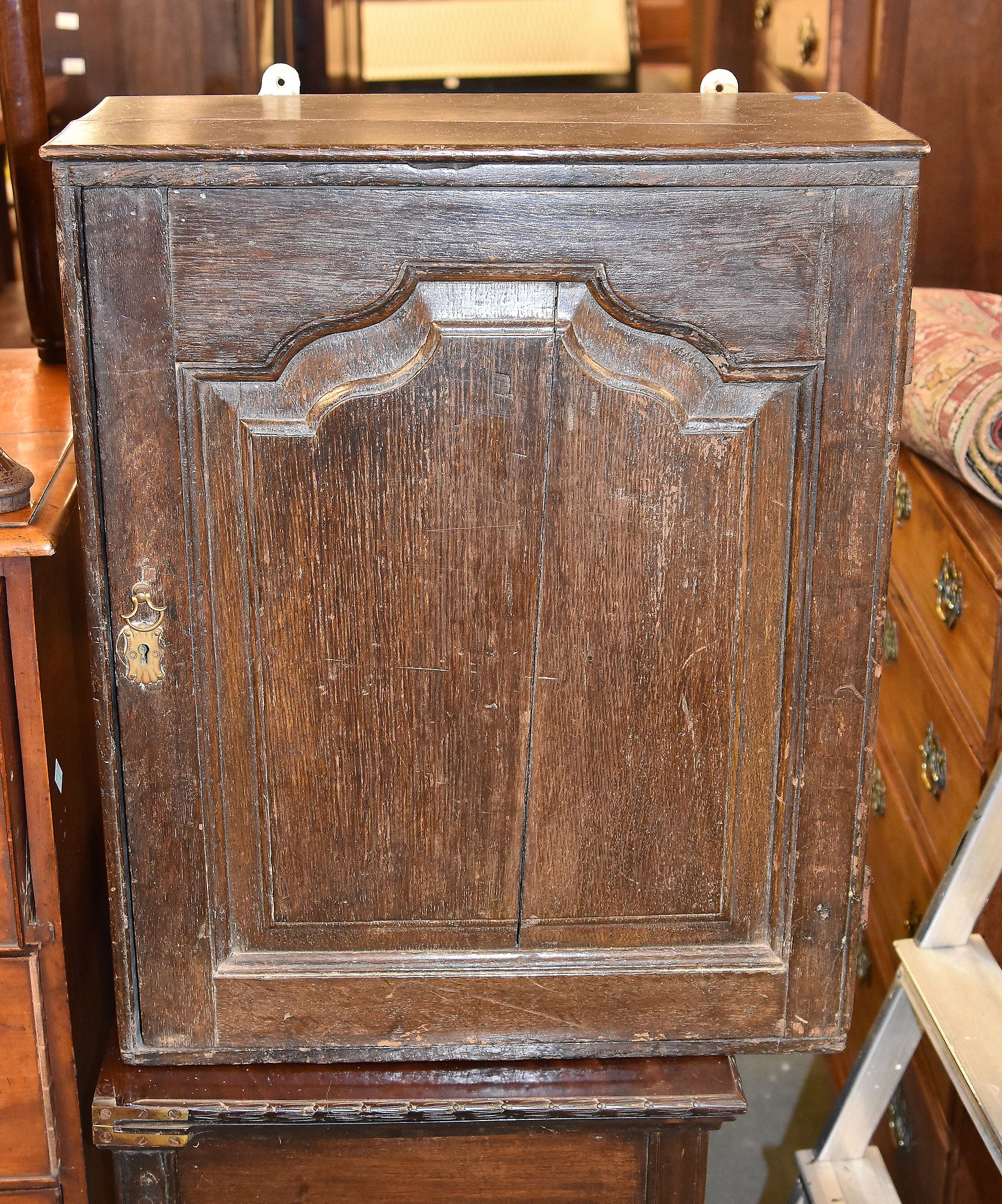 An oak wall cupboard with fitted interior, in part 18th century, 63cm high, 52cm wide
