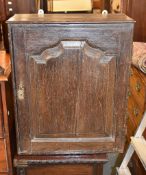 An oak wall cupboard with fitted interior, in part 18th century, 63cm high, 52cm wide