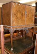 A 1930s walnut drinks cabinet in the Queen Anne style, 115cm high