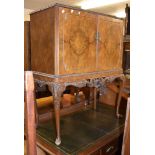 A 1930s walnut drinks cabinet in the Queen Anne style, 115cm high