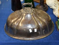 An electro-plated oval meat cover, with a foliate loop handles and engraved with a crest, 46cm long