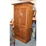 An oak press cupboard, circa 1900, with pair of cupboard doors above the drawers, 102cm wide overall