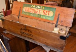 A boxed croquet set, with four mallets and corresponding coloured balls, the pine case with label