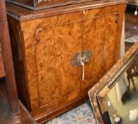 A walnut drinks cabinet in George I style, with label to rear for George Strachan & Son Ltd, 122cm