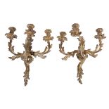 A pair of gilt metal twin light wall appliques, in Louis XV taste, first half 20th century, cast