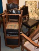 A set of six oak and leather upholstered chairs in Cromwellian style , 20th century, to include a