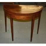 A George III mahogany folding card table, of demi-lune outline, 86cm wide