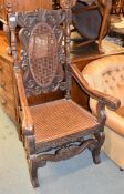 A carved oak chair in early 18th century style, with rattan inset panel to back