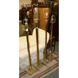 A pair of gilt metal columnar standard lamps, 20th century, 137cm high; and two further examples
