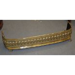 A brass fender, mid-19th century, with lobed and beaded bands, 22cm high, 106cm wide