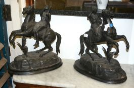 A pair of Continental spelter equestrian groups, early 20th century, 38cm high