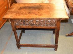 A Continental walnut side table, the drawer with geometric designs, 74cm high, 102cm wide, 60cm deep