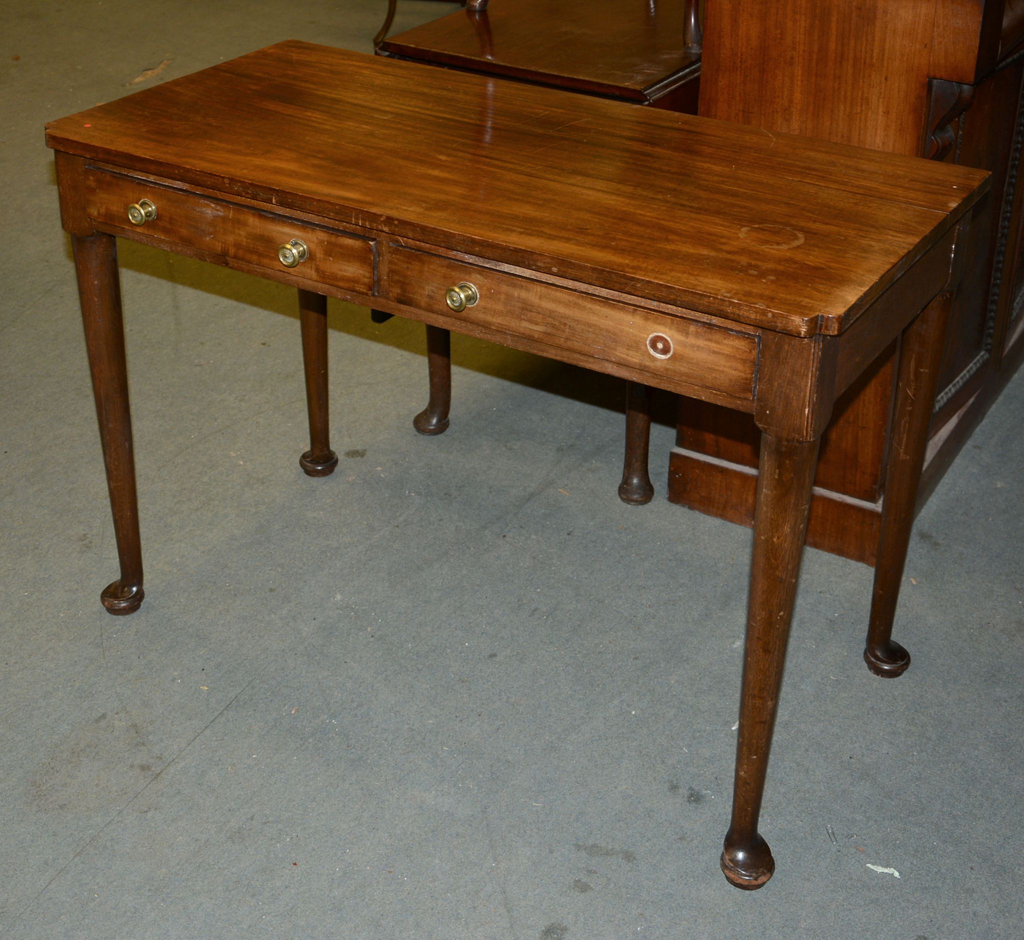 A mahogany side table, 19th century, with two frieze drawers and tapering legs, 74cm high, 102cm
