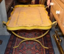 A yellow painted tray on stand in Regency style