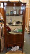 An Edwardian mahogany and line inlaid display cabinet, of serpentine outline, 173cm high, 69cm deep