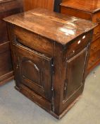 An oak hanging wall cupboard, first half 18th century, with panelled door and drawer, 72cm high,