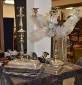 A small quantity of silver plated items comprising tureens and covers, a candelabra, a further