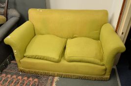 A green-yellow upholstered two seat sofa, 145cm long
