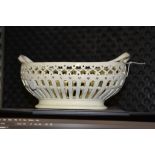 A creamware twin handled basket, probably Leeds, pierced decoration throughout, 25cm wide