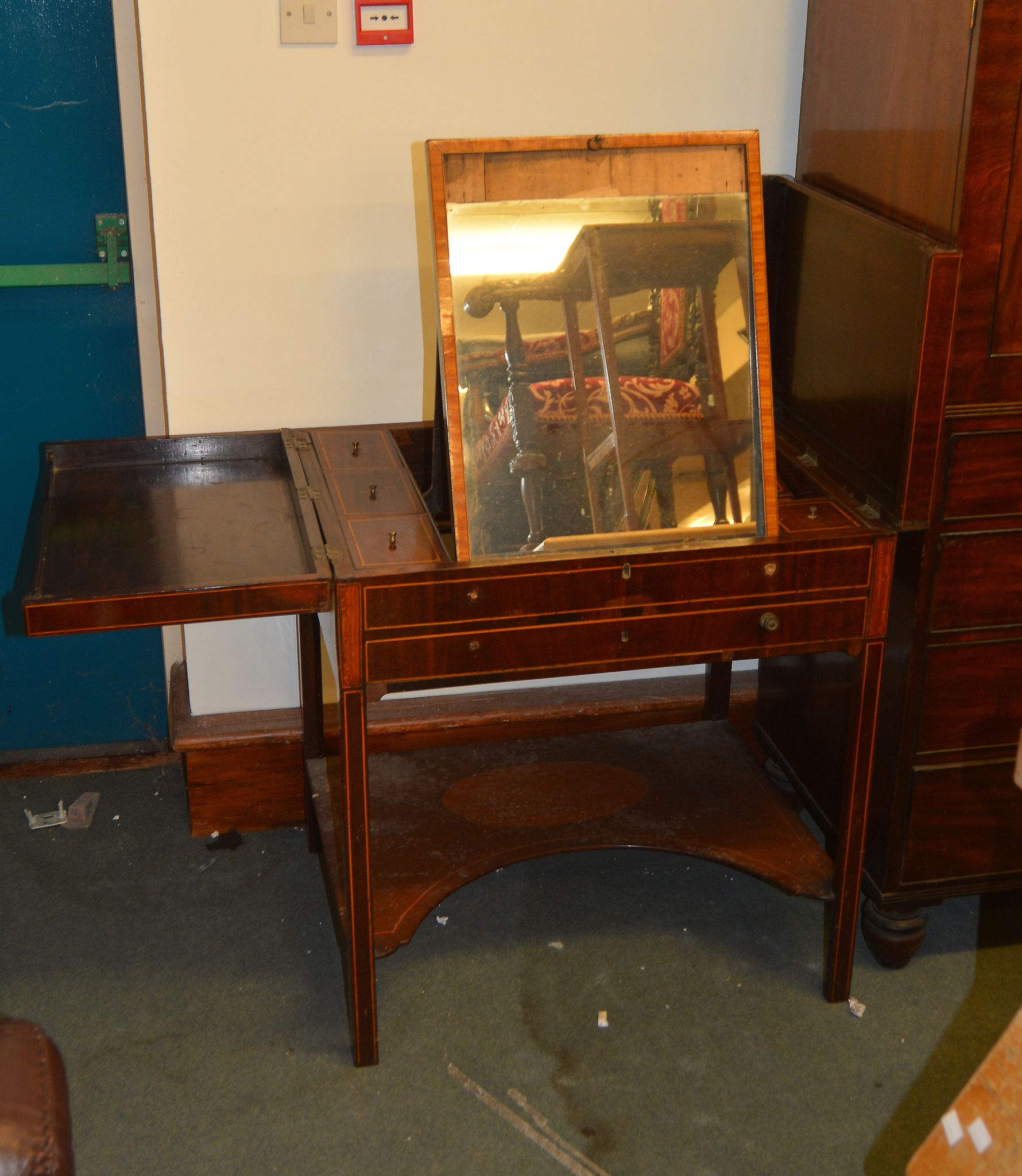 A George III Gentleman's mahogany and satinwood crossbanded travelling dressing table, with fitted